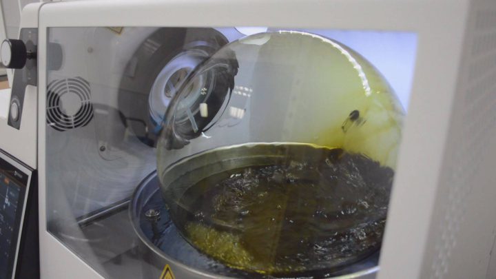 Medicinal cannabis oil is refined at CanniMed's Saskatoon headquarters. CanniMed has told its shareholders to wait while it reviews a surprise offer from Aurora to take over the marijuana producer.