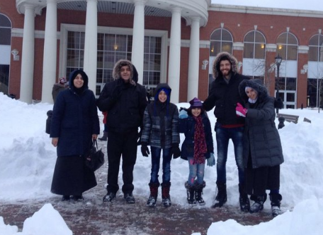 Tareq Hadhad, second right, is pictured with his family outside the Charles V. Keating Millenium Centre in Antigonish, N.S.  