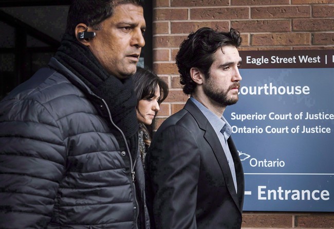 Marco Muzzo, right, leaves the Newmarket courthouse surrounded by family, on February 4, 2016.