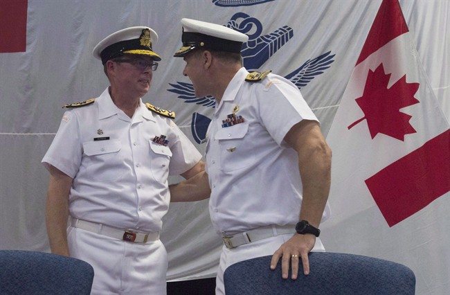 Royal Canadian Navy Vice-Admiral Mark Norman (left) speaks with Vice-Admiral Ron Lloyd during a change of command ceremony, Thursday, June 23, 2016 in Ottawa. 