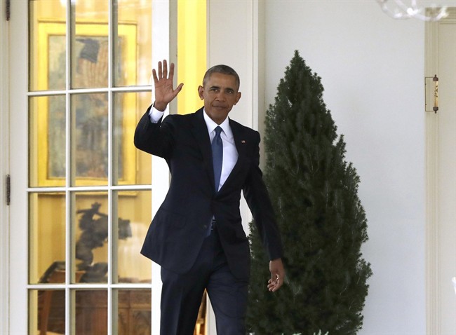 President Barack Obama waves as he leaves the Oval Office of the White House in Washington, Friday, Jan. 20, 2017.