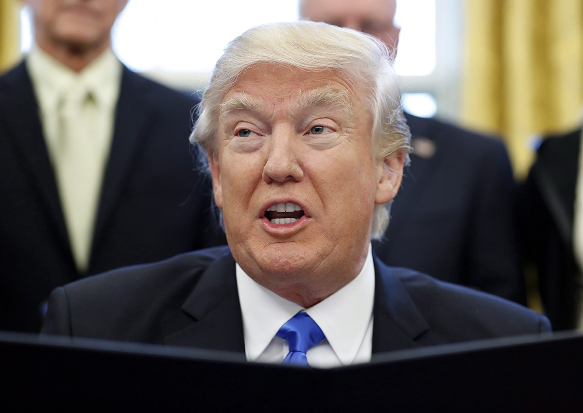 President Donald Trump speaks before signing an executive action in the Oval Office, Saturday, Jan. 28, 2017, in Washington. 