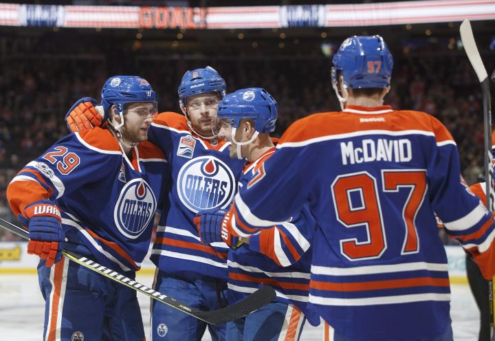Edmonton Oilers' Leon Draisaitl (29), Adam Larsson (6) Andrej Sekera (2) and Connor McDavid (97) celebrate a goal against the New Jersey Devils during second period NHL action in Edmonton, Alta., on Thursday January 12, 2017. 