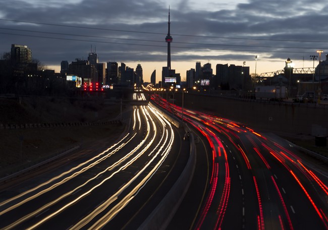 The headlights and tail lights of vehicles are shown as commuters travel into Toronto on the Gardiner Expressway in the early morning hours of Friday January 27, 2017. 