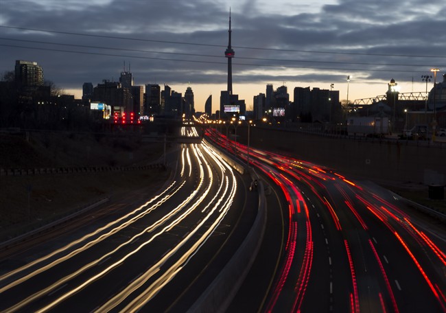 The headlights and tail lights of vehicles are shown as commuters travel into Toronto on the Gardiner Expressway in the early morning hours of Friday January 27, 2017.