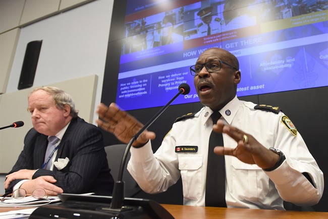 Toronto Police Chief Mark Saunders speaks during a news conference as Andy Pringle, chairman of the police services board, looks on in Toronto on Thursday Jan. 26, 2017.