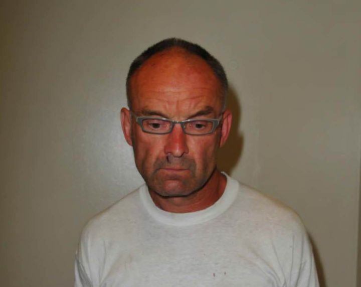 Photos of Douglas Garland taken by police following his arrest in July 2014.