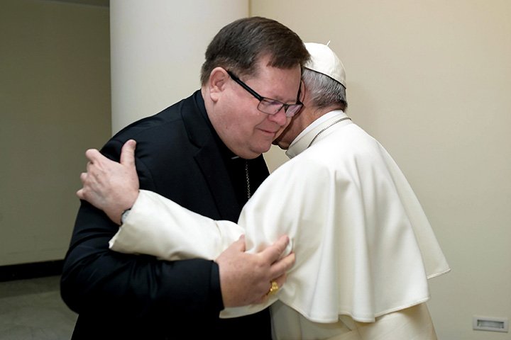 Pope Francis hugs archbishop of Quebec, Cardinal Gerald LaCroix, as they meet at the Santa Marta residence, at the Vatican Monday, Jan. 30, 2017.