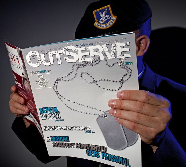 A gay member of the US Air Force, who chooses to not be identified, reads a copy of a magazine intended for actively serving lesbian, gay, bisexual and transgender US military members on September 15, 2011 in Washington. 
