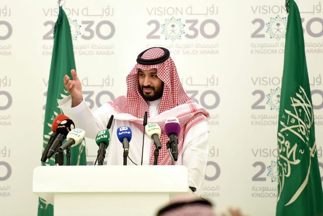 Saudi Defense Minister and Deputy Crown Prince Mohammed bin Salman gestures during a press conference to discuss his 'Vision 2030' plan in Riyadh, on April 25, 2016.