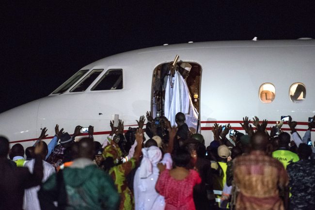 Ex-President Yahyah Jammeh waves to a crowd of supporters before leaving the country on January 21, 2017 at Banjul International Airport in Banjul, The Gambia. 