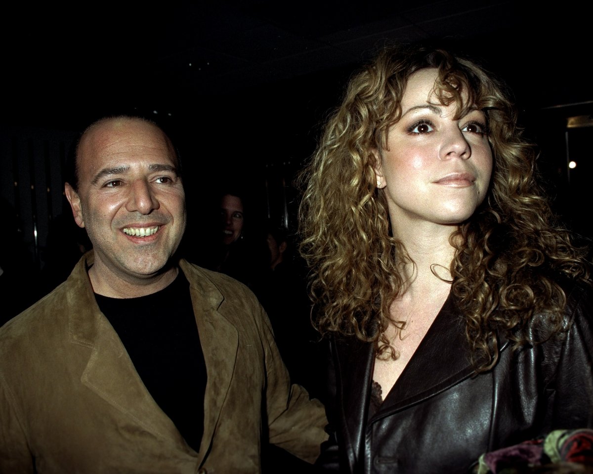 Tommy Mottola and Mariah Carey at movie premiere of "The Devil's Own" at the Cinema One Theater.