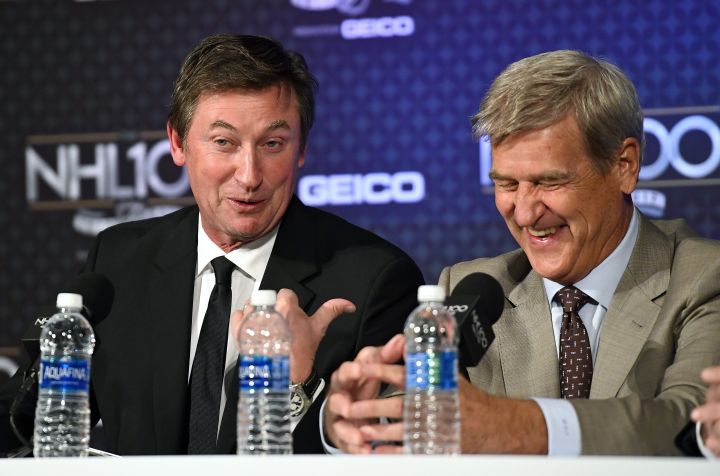 Wayne Gretzky, left, points to Bobby Orr during a news conference prior to an NHL 100 ceremony, Friday, Jan. 27, 2017, in Los Angeles.  