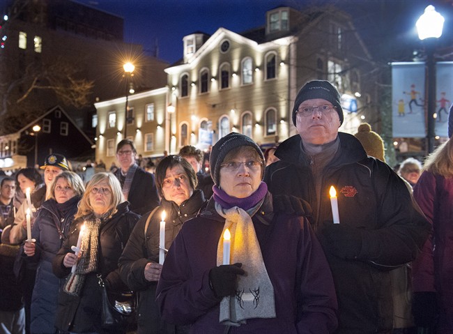 People attend a vigil for victims of a shooting at a mosque in Quebec City on Sunday, at the Grand Parade in Halifax on Monday, Jan. 30, 2017. Six people died in the attack which occurred during evening prayers.