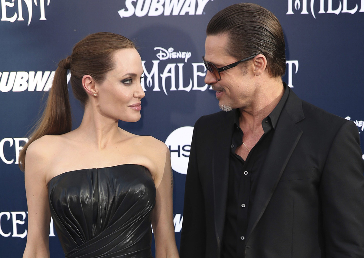 In this May 28, 2014 file photo, Angelina Jolie and Brad Pitt arrive at the world premiere of "Maleficent" in Los Angeles. 