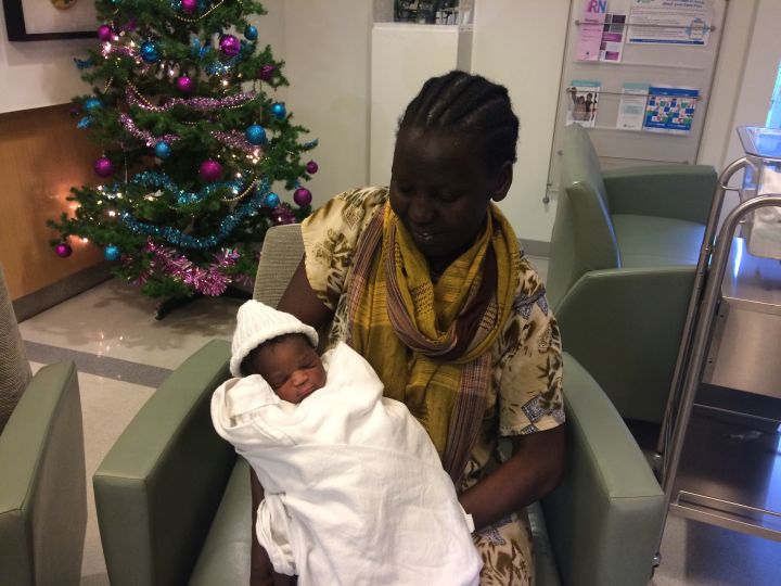 Nyadin Nyoak shows her new baby Joy off to reporters on Jan. 1, 2017. Joy was the first baby born in Edmonton in 2017.