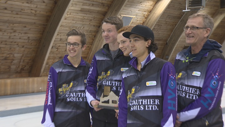 Skip JT Ryan, Third Jacques Gauthier, Second Graham McFarlane, Lead Brendan Bilawka, and Coach John Lund pose with the trophy after winning the 2017 Junior Men's Provincial Championships.