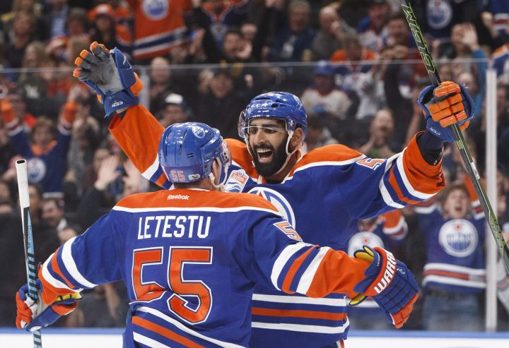 Edmonton Oilers' Mark Letestu (55) and Jujhar Khaira (54) celebrate a goal against the Arizona Coyotes during second period NHL action in Edmonton, Alta., on Monday January 16, 2017. 