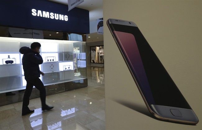 A man walks by an advertisement of the Samsung Electronics Galaxy smartphone in Seoul, South Korea on Friday, Jan. 6, 2017. Samsung Electronics Co. said Friday that its profits in the last quarter of 2016 surged 50 percent to the highest level in more than three years, despite the Galaxy Note 7 fiasco.