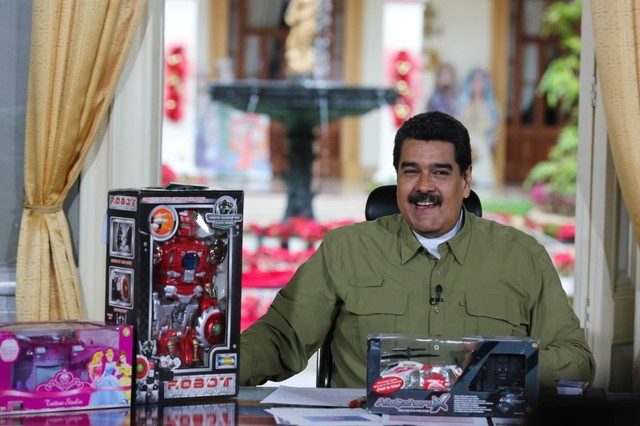 Venezuela's President Nicolas Maduro speaks next to children toys during his weekly broadcast "En contacto con Maduro" (In contact with Maduro) at Miraflores Palace in Caracas, Venezuela December 18, 2016. 