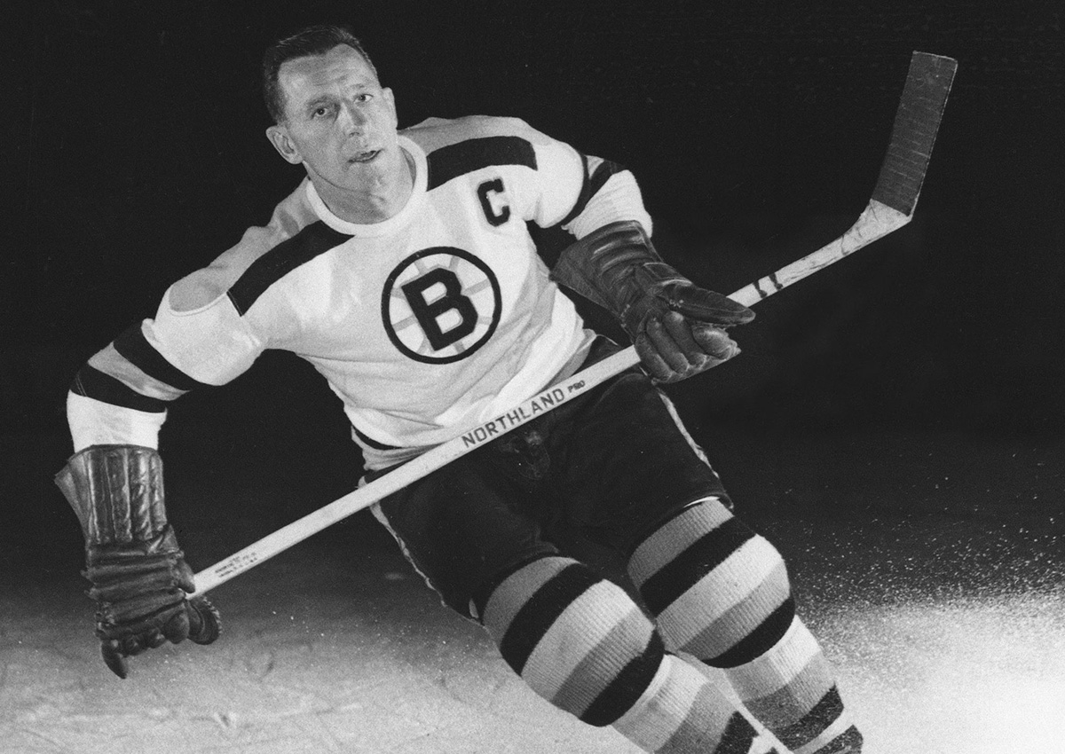 In this Sept. 1953, file photo, Milt Schmidt, captain of the Boston Bruins, is shown in an action pose.
