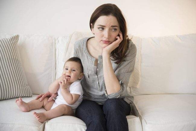 Mother with new baby suffering from postpartum depression.