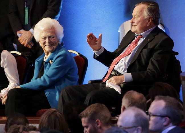 FILE - In this Thursday, Feb. 25, 2016 file photo, former President George H. W. Bush, right, and his wife, Barbara, are greeted before a Republican presidential primary debate at The University of Houston in Houston. On Wednesday, Jan. 18, 2017, the former president was admitted to an intensive care unit, and Barbara was hospitalized as a precaution, according to his spokesman. (AP Photo/David J. Phillip).
