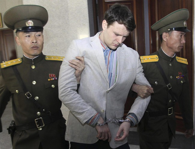 In this March 16, 2016, file photo, American student Otto Warmbier, center, is escorted at the Supreme Court in Pyongyang, North Korea. Warmbier died days after he was released from North Korean detention.