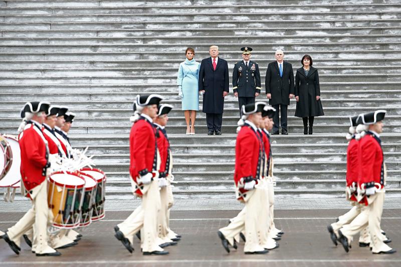 U.S. President Donald Trump (2L), with (L-R) first lady Melania Trump, Maj. Gen. Bradley Becker, Vice President Mike Pence and his wife Karen Pence review troops on the East Front of the U.S. Capitol on January 20, 2017 in Washington, DC. In today's inauguration ceremony Donald J. Trump becomes the 45th president of the United States.