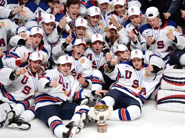 Team USA celebrate with the cup after defeating Canada during in the IIHF World Junior Championships gold medal hockey action Thursday, January 5, 2017 in Montreal.THE CANADIAN PRESS/Ryan Remiorz.