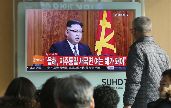 South Koreans watch a TV news program showing North Korean leader Kim Jong Un's New Year's speech, at the Seoul Railway Station in Seoul, South Korea, Sunday, Jan. 1, 2017. North Korea's development of banned long-range missiles is in "final stages," the country's leader Kim was quoted as saying in his New Year's message. The letters read "New Year for Reunification.".