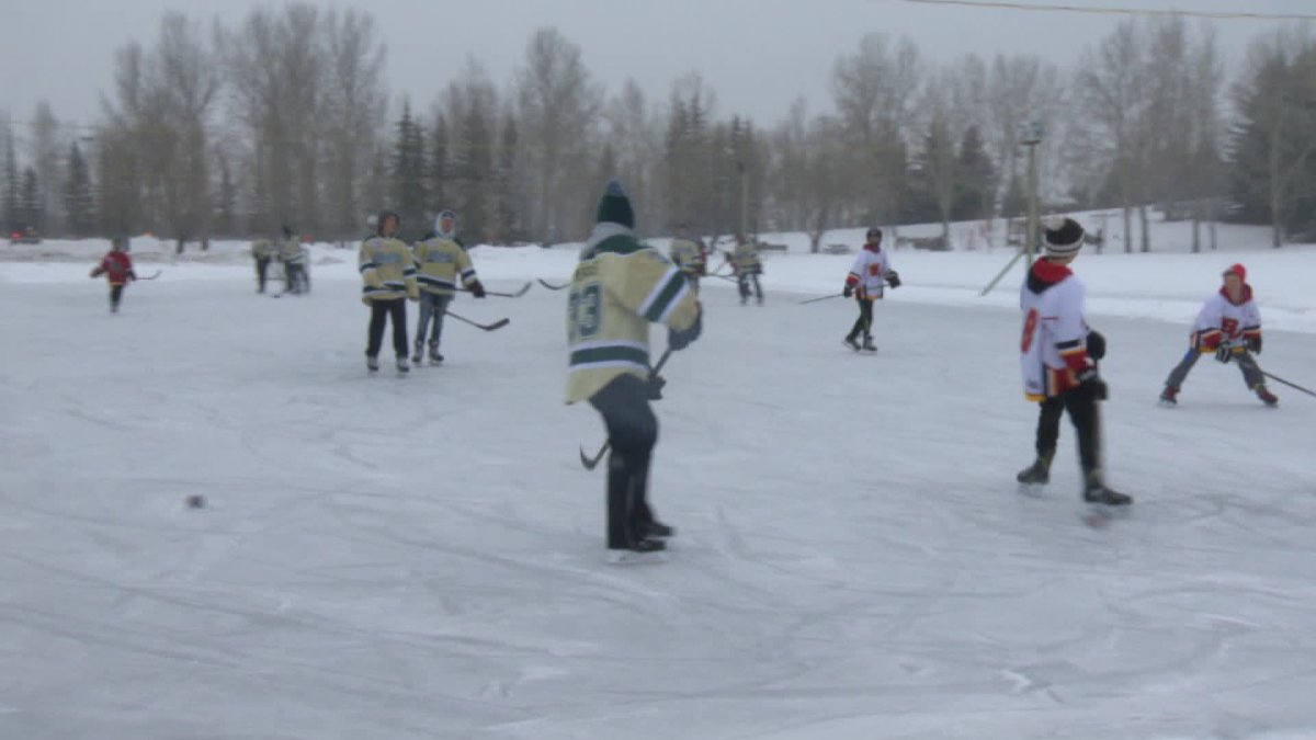 Calgarians playing hockey on McKenzie Lake for Skate the Lake fundraiser. 