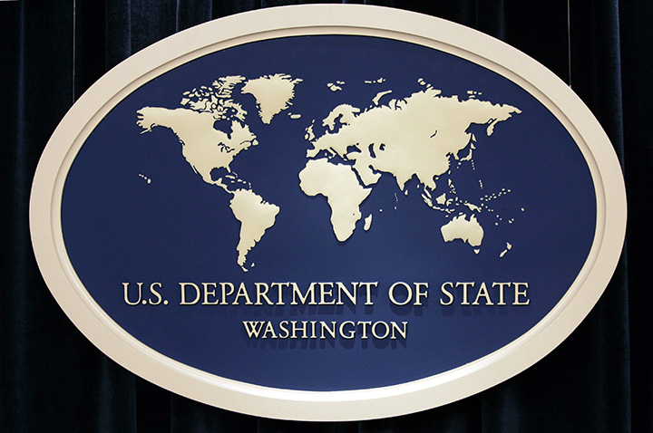 In this Aug. 10, 2006 file photo, the sign used as the backdrop for press briefings at the U.S. Department of State is seen before a news conference at the State Department in Washington. 