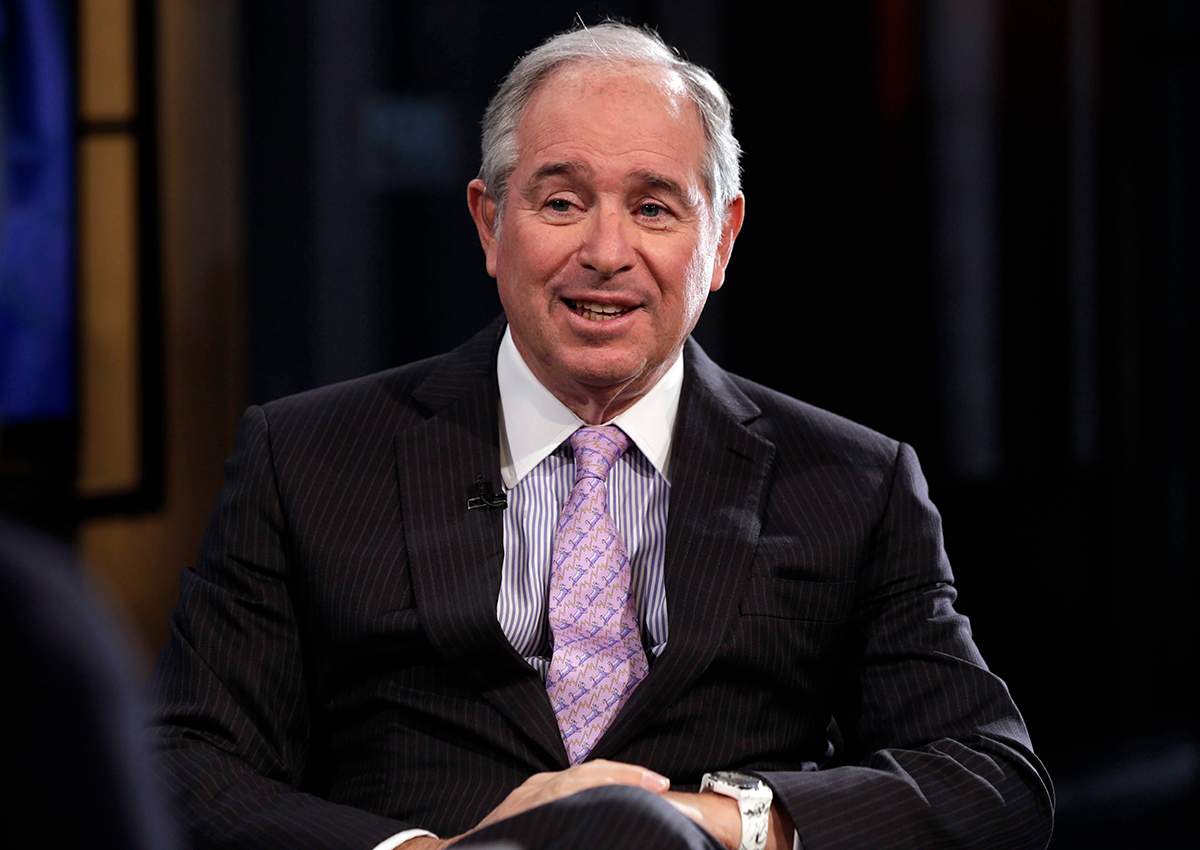 FILE - In this Feb. 27, 2014 file photo, Blackstone Group CEO Stephen Schwarzman is interviewed by Maria Bartiromo during her "Opening Bell with Maria Bartiromo" program, on the Fox Business Network, in New York. President-elect Donald Trump on Friday, Dec. 2, 2016, announced the formation of an advisory group, led by Schwarzman, of more than a dozen CEOs and business leaders who will offer input on how to create jobs and speed economic growth.  (AP Photo/Richard Drew, File).
