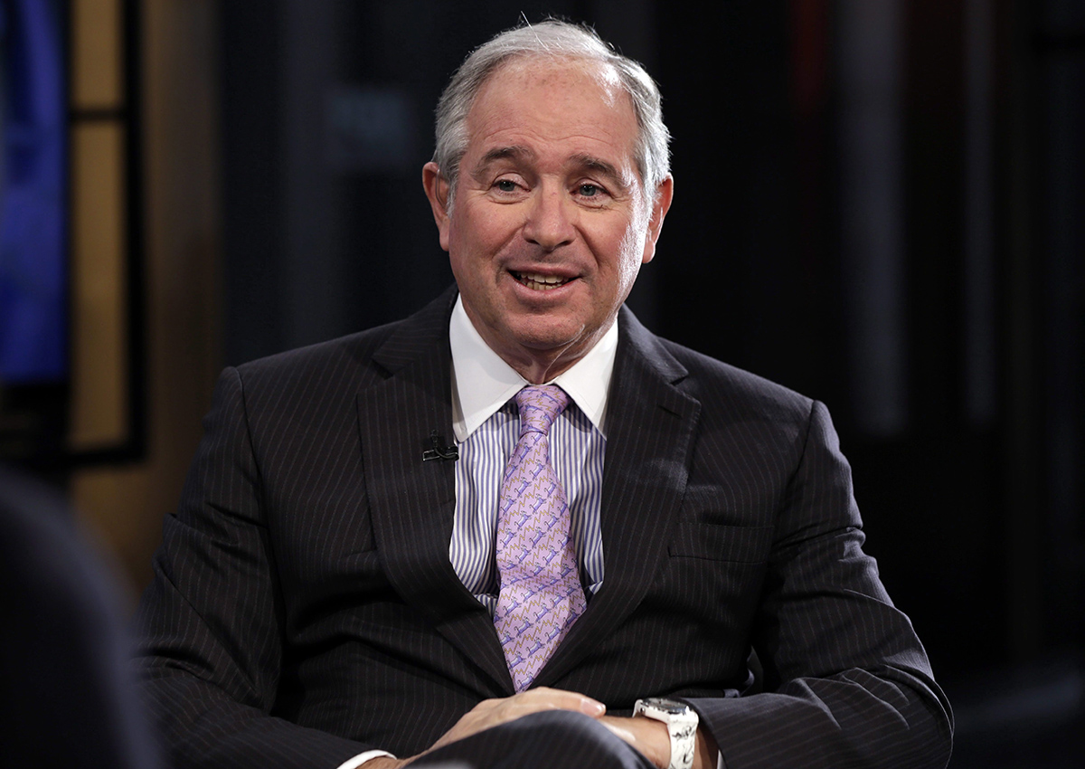 FILE - In this Feb. 27, 2014 file photo, Blackstone Group CEO Stephen Schwarzman is interviewed by Maria Bartiromo during her "Opening Bell with Maria Bartiromo" program, on the Fox Business Network, in New York. President-elect Donald Trump on Friday, Dec. 2, 2016, announced the formation of an advisory group, led by Schwarzman, of more than a dozen CEOs and business leaders who will offer input on how to create jobs and speed economic growth.  (AP Photo/Richard Drew, File).