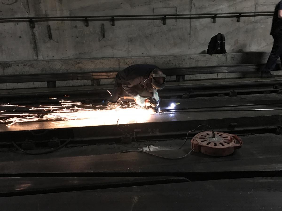 A welder fixes the tracks on the orange line of the Montreal Metro.