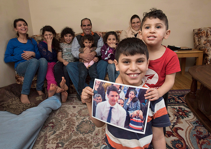 Abdel Al Shaikh, 10, holds a photo taken of him during Prime Minister Justin Trudeau’s recent visit to Fredericton, Saturday, Jan.21, 2017.