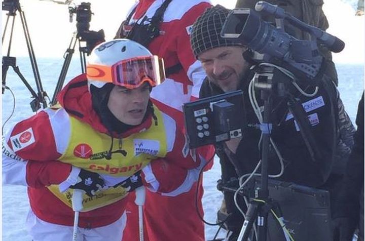 Skier Mikael Kingsbury reviewing a recent run with coach Rob Kober at the FIS Freestyle Ski World Cup moguls event. 