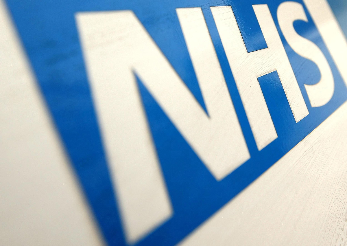 In this Dec. 12, 2010 file photo of the NHS Logo. The British Red Cross says overcrowding in hospital emergency rooms has become a "humanitarian crisis." .