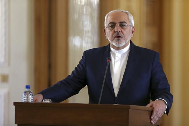 Iranian Foreign Minister Mohammad Javad Zarif speaks at a joint press conference with his French counterpart Jean-Marc Ayrault, in Tehran, Iran, Tuesday, (AP Photo/Vahid Salemi).