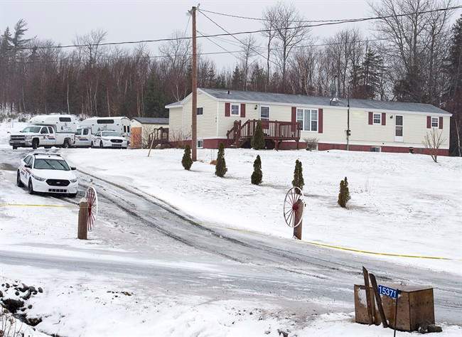 Police vehicles are seen outside a residence in Upper Big Tracadie, N.S. on Wednesday, Jan. 4, 2017. 