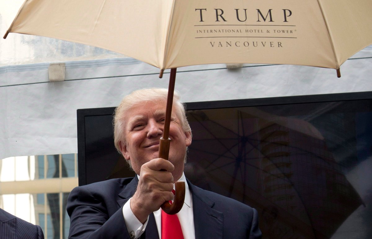 Donald Trump holds a ceremonial umbrella given to him during an announcement in downtown Vancouver, B.C. Wednesday, June 19, 2013. The Trumps were on Canada's west coast to announce the building of Trump International Hotel and Tower Vancouver. 
