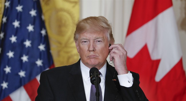 President Donald Trump listens during a joint news conference with Canadian Prime Minister Justin Trudeau in the East Room of the White House in Washington, Monday, Feb. 13, 2017. 