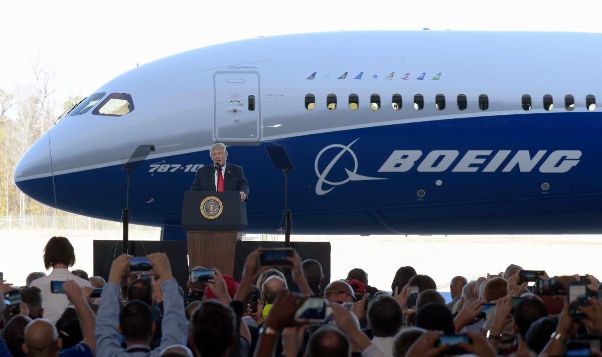 President Donald Trump speaks in front of the Boeing 787 Dreamliner while visiting the Boeing South Carolina facility in North Charleston, S.C., Friday, Feb. 17, 2017.