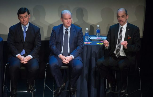 Candidates Michael Chong, left, and Erin O'Toole, centre, listen as Steven Blaney speaks during a federal Conservative Party leadership debate in Vancouver, B.C., Feb. 19, 2017. 