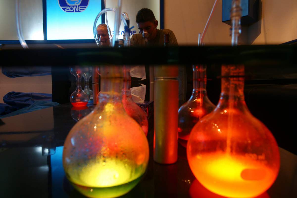 Tourists breath flavored oxygen at an oxygen bar in La Paz, Tuesday, June 12, 2007.