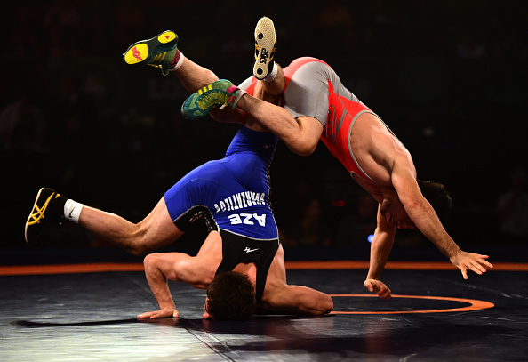 Akhmednabi Gvarzatilov of Azerbaijan gets tangled with Behnam Ehsanpoor of Iran during the 2016 United World Wrestling World Cup at The Forum on June 11, 2016 in Inglewood, California.  