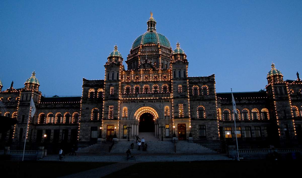 The British Columbia Legislature building in Victoria, B.C. is lit up at dusk.