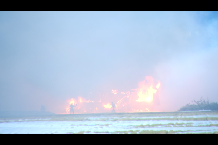 Fire crews kept cameras well back as they fought a barn fire in Abbotsford Monday morning.