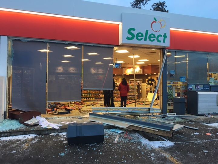 Police investigate after a black Ford F-150 crashed into the front of a convenience store in Whitecourt, Alta. shortly after 4 a.m. On Feb. 1, 2017.